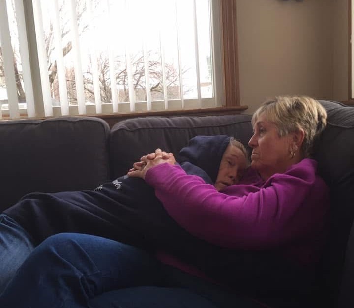 Julie Foster (left) is consoled by her mother.