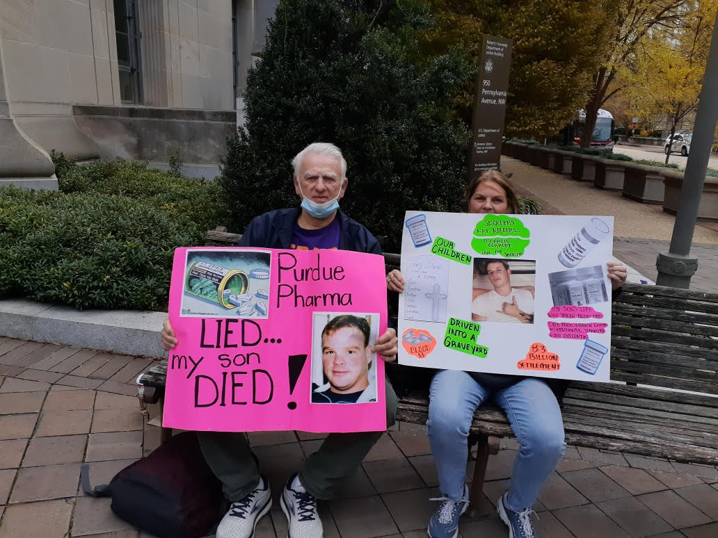 Tony LaGreca with fellow activist Denise Sharp in front of the the Department of Justice in Washington, D.C. at a Big Pharma protest. 